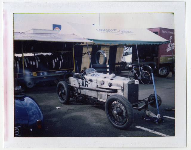 A vintage car in the paddock at Silverstone