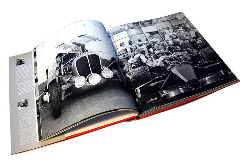 Cars in garages in the Passion Le Mans book