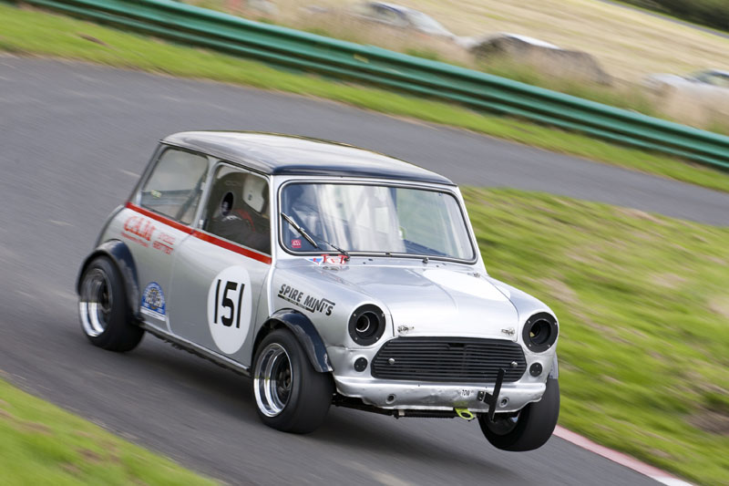 A mini car hillclimbing, and getting onto two wheels