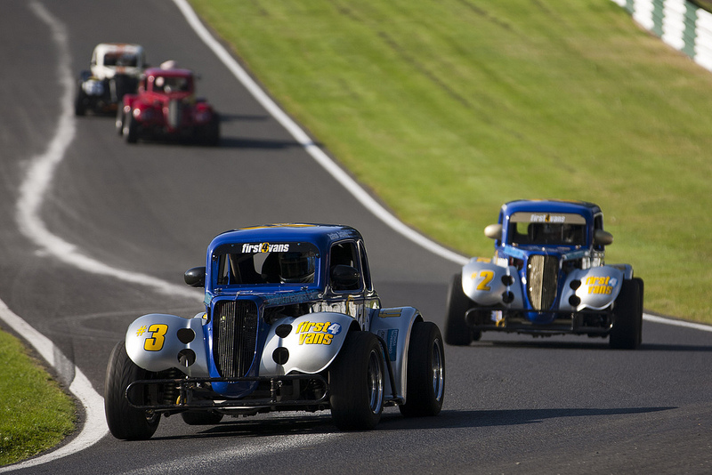Two legends cars entering the Hall Bends section at Cadwell Park