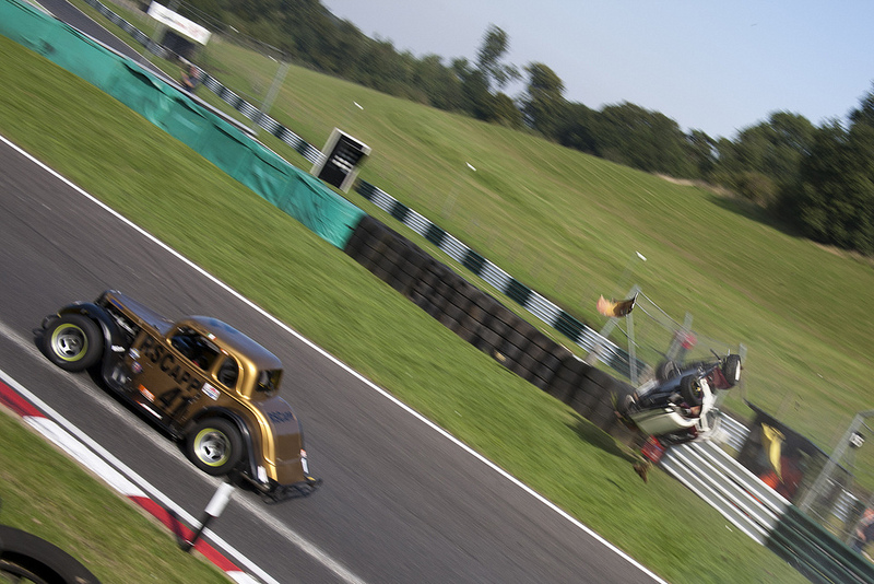 robert_king_crash A Legends car driven by Robert King rolling as Elliot Bunn passes by
