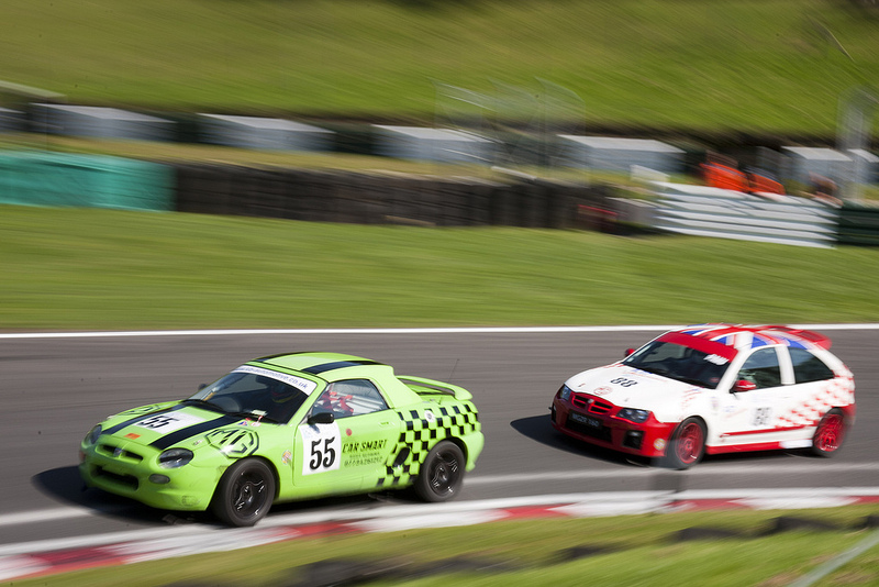 Two cars battling for the lead at Cadwell Park