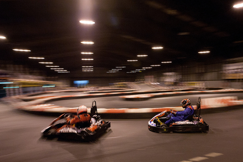 Drivers battling past the pits at the 24h endurance event