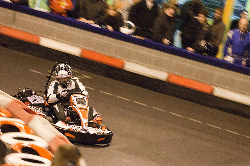A kart racing past the pits during the PPiK Ginetta 24h event