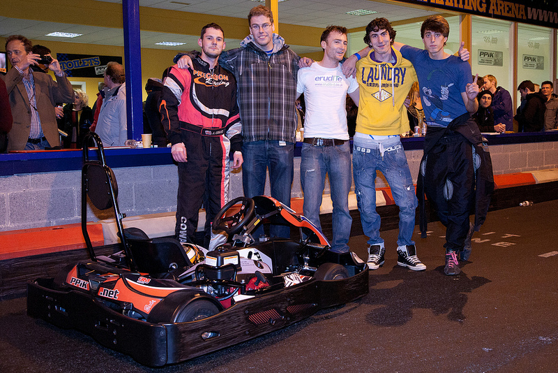 The winning CFT Services team stand with their kart after the race