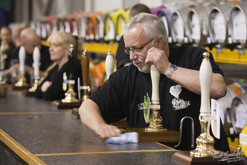 A staff member cleans the bar at KWVR