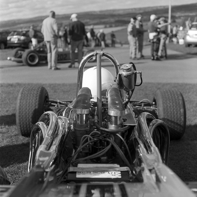 Black and white photograph of a classic single seater at Harewood Hillclimb